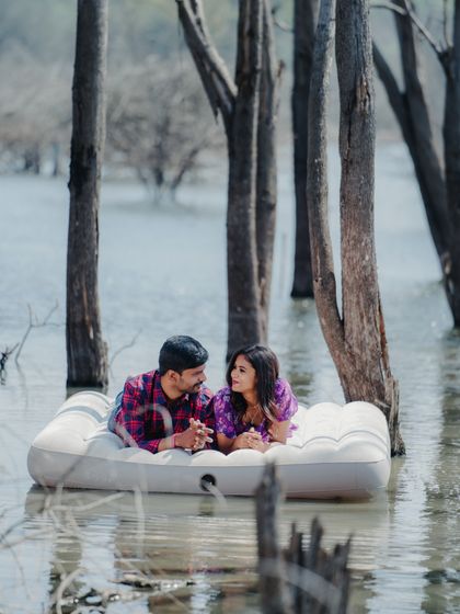 Looking into each other's eyes, this couple shares a special connection during their one-of-a-kind lake photoshoot.