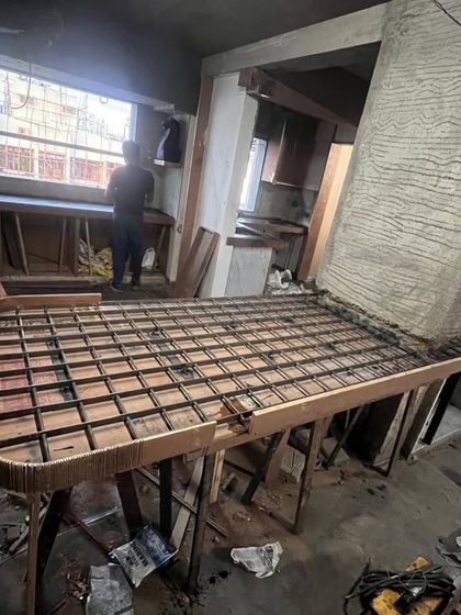 This image shows the reinforcement structure for the cantilevered table before the final finish was applied. This behind-the-scenes look reveals the engineering required to achieve the floating, sculptural design.