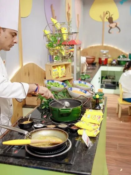 Parties work up an appetite, and our in-house Tooney Cafe is ready. We offer options like live cooking stations, such as this popular Maggi counter, ensuring fresh, delicious food that both kids and adults love.