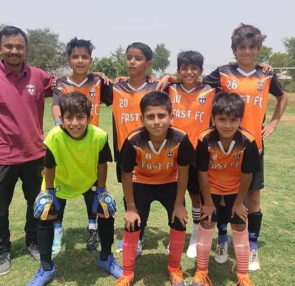 The U11 runners-up squad with their coach, proud of their performance in the Junior Cup.