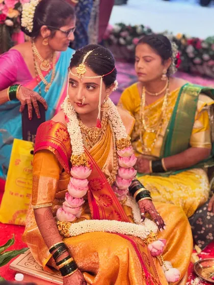A beautiful candid shot of my bride during her wedding rituals. Her makeup is subtle yet radiant, designed to last through the long ceremony while looking fresh and natural.