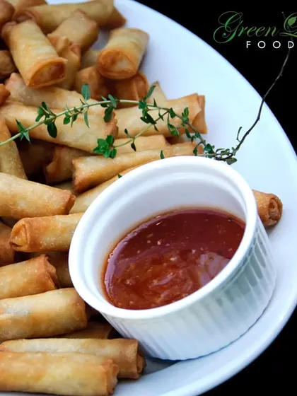 Crispy, golden, and delicious. Our mini spring rolls are the perfect finger food for any occasion, served with a tangy sauce that complements the savory vegetable filling.