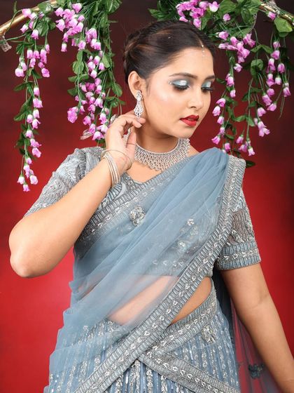 This shot showcases the glittery details on the eyelid. The silver cut-crease effect adds a touch of modern glamour to this sophisticated party makeup look.