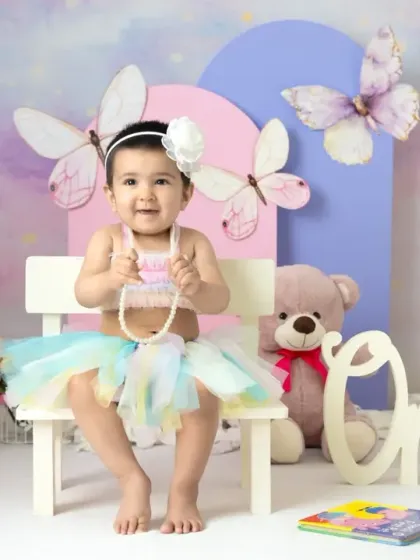 A magical unicorn and butterfly theme for a first birthday. The pastel colors, whimsical props, and dreamy backdrop create a true fairy tale setting.