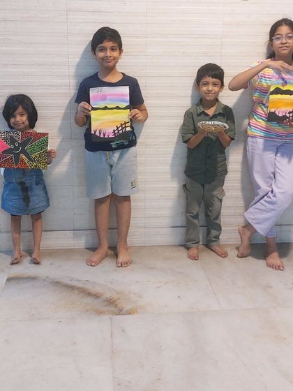 A group of my talented students showcasing their artwork. From dot painting to landscapes, there's a wide range of styles and creativity on display.