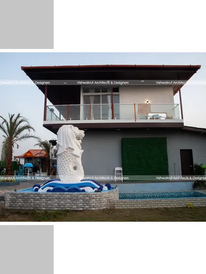 Another angle of the completed Rock Villa, showing the relationship between the main building, the pool, and the Merlion water feature.