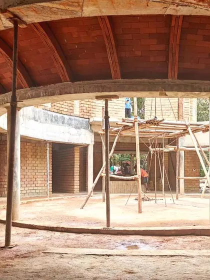 A brick vault under construction. This image captures the raw beauty of the building process, showing the structural logic and inherent texture of arched masonry before the final finishes are applied.