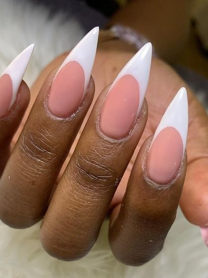 A close-up of my stiletto French tip extensions. The matte pink base contrasts beautifully with the glossy white tips.