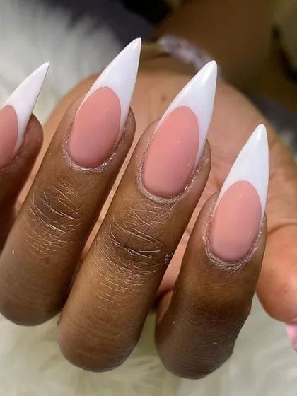 A close-up of my stiletto French tip extensions. The matte pink base contrasts beautifully with the glossy white tips.