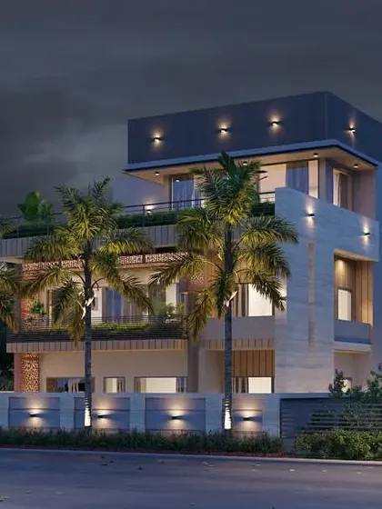 A night view of the farmhouse, illustrating the facade lighting scheme. The lighting highlights the building's architectural features and the texture of the materials.