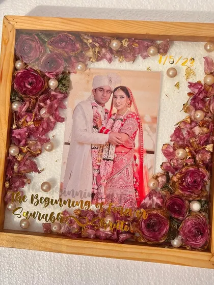 A full view of the finished teak wood frame, a timeless piece of art preserving a couple's most cherished memories.