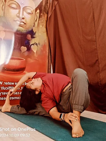 A variation of Parivrtta Janu Sirsasana (Revolved Head-to-Knee Pose). Twisting poses are powerful for detoxifying the body and releasing tension in the spine.