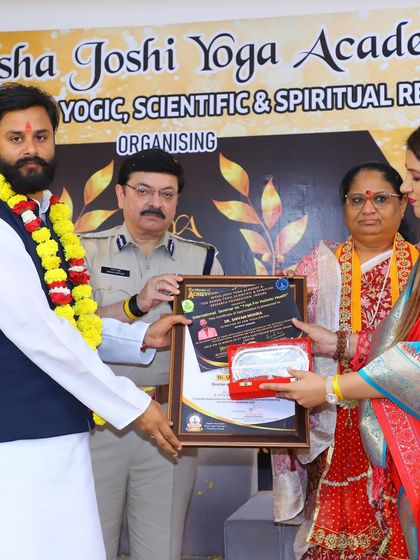 A moment from the award ceremony in Indore, where I was honored for my contributions to the field of yoga.