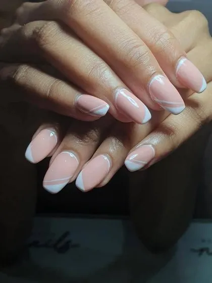 Don’t miss the intricate detailing of these gorgeous pastel nails. This is a beautiful abstract take on the French manicure.