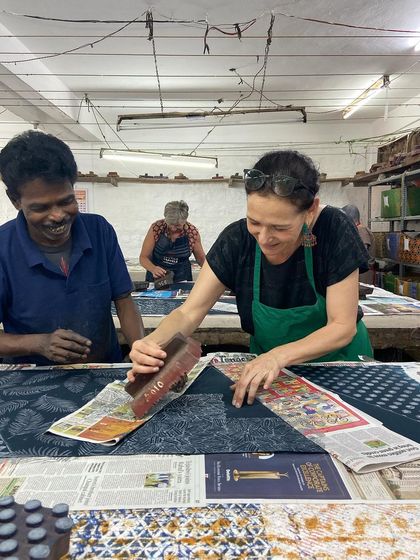 A participant from a textile tour group smiles as she learns from our artisan. Our workshops are designed to be joyful, welcoming spaces for everyone, from beginners to seasoned textile lovers.