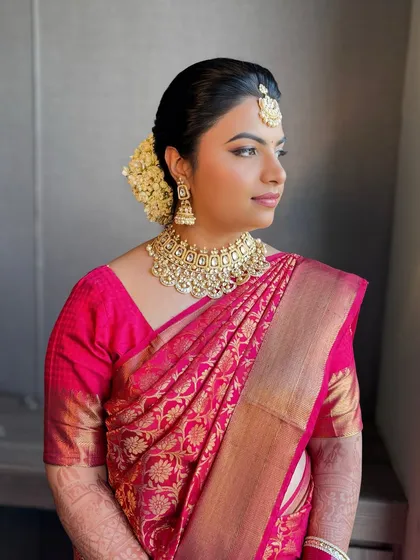 A beautiful morning bride. Ritz's pink silk saree was paired with a classic South Indian-inspired makeup look and a gajra bun.