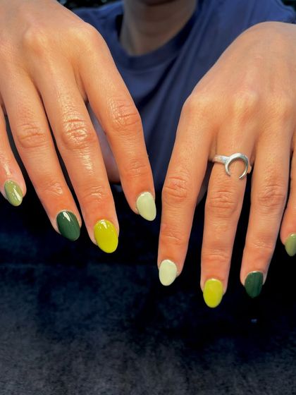 A different view of the "shades of green" manicure, showing the combination of colors from another angle.