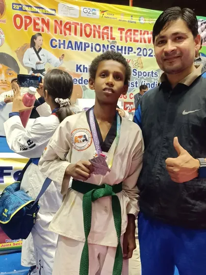 Another one of our students with his silver medal, showing great promise for the future.