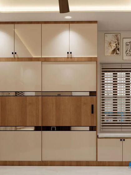 A bedroom with a large wardrobe that has a mix of wood and white finishes, and an integrated window seat.