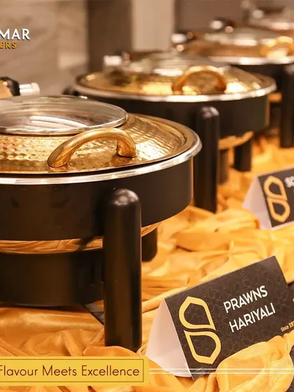 Our buffet setup is designed for both beauty and function, ensuring a smooth flow for guests. Here, you can see the clear labels for each dish, like Prawns Hariyali.