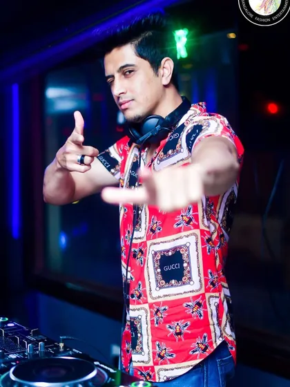 Pointing to the crowd, ready for the next drop. This interaction is fueled by the music, and I produce tracks that build anticipation and deliver an energetic release.