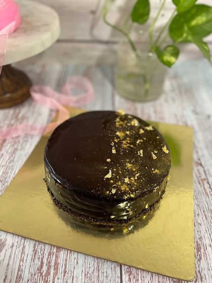 Celebrate Dad with a cake that's just for him. This Father's Day cake features a fun tic-tac-toe design, showing him he's a winner. Whether it's a simple mango cake or a rich chocolate one, it's a sweet way to show you care.