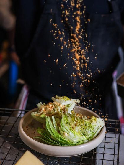 Who said salads have to be boring? Here, I'm adding a sprinkle of crunchy butter croutons to the Manor Caesar Salad.