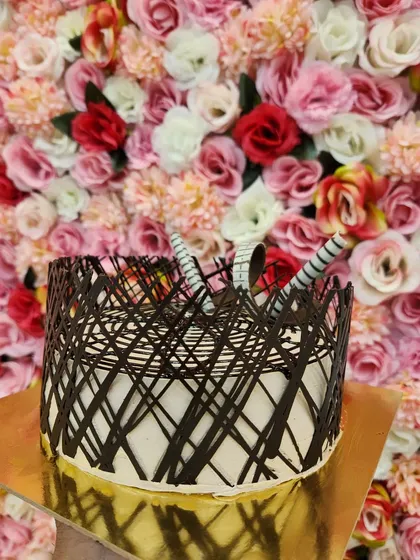 My Chocolate Italian cake is all about texture and rich flavor. This design features a chocolate lattice wrap, creating a beautiful and intricate look that's perfect for a special occasion.