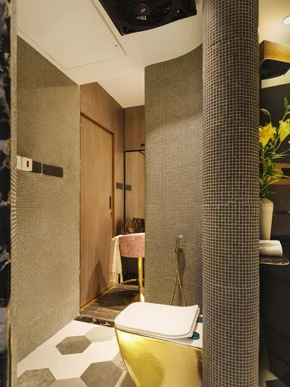 The walk-in closet area, featuring curved walls with mosaic tiles and a distinct separation of spaces for a luxurious experience.