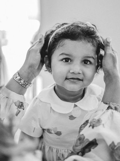 A sweet moment between mother and daughter, getting ready for her birthday celebration. These black and white photos add a timeless, documentary feel.
