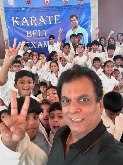 Victory signs with the children. Each belt promotion is a victory and a step forward in their karate journey.