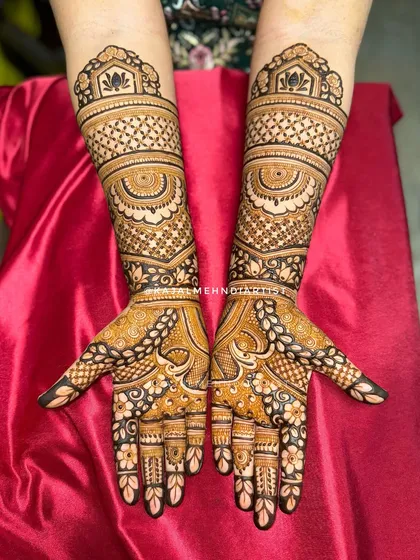A beautifully clear shot of the Indian henna design against a red background.