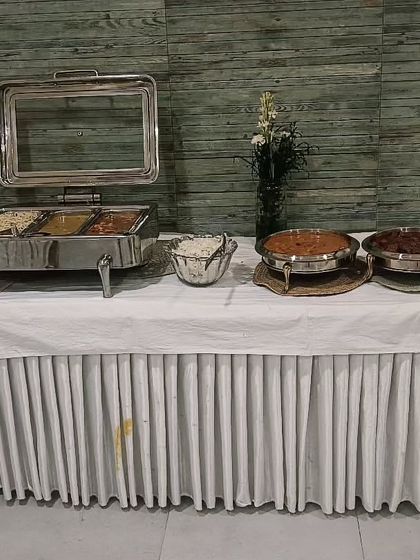 Another view of the buffet for a Raksha Bandhan celebration. The spread includes a variety of main courses and desserts to make the festival meal complete.