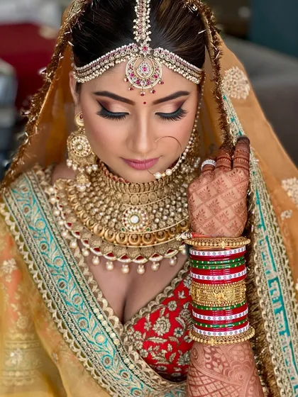 Creating the perfect royal bridal look is about balancing tradition with a flawless finish. This look features classic kohl-rimmed eyes and a radiant base, ensuring the bride feels like a true Maharani on her big day.