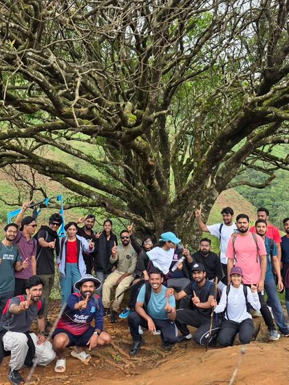Taking a break under a magnificent old tree. These natural landmarks become memorable spots along our trekking routes.