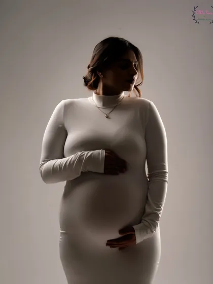 A close-up silhouette in a simple white dress. This technique uses light and shadow to create a soft, intimate, and artistic portrait.