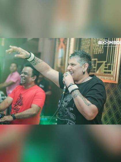 The legendary Ma Faiza on the mic, hyping up the crowd during the 'INTIMATE' party. I bring icons of the Indian dance music scene to exclusive club settings.