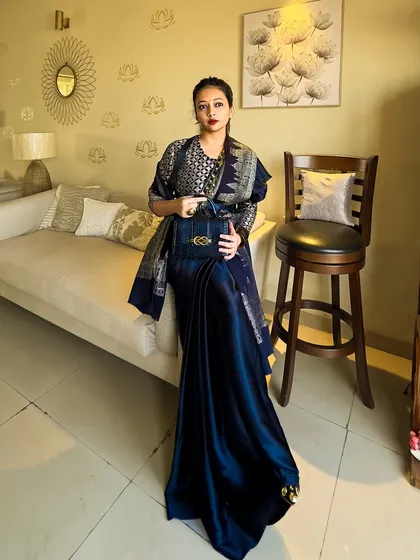 The full Sabyasachi-inspired look, showing how the Kashmiri shawl is draped over one shoulder to create a regal, layered effect. The dark blue satin saree provides a luxurious base.