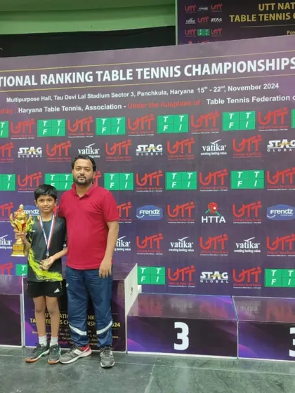 Our coach with Arunim Aggarwal and his trophy after his bronze medal win at the National Ranking Tournament.