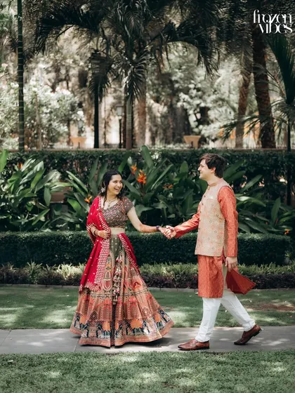 A candid walking shot of Shubhi and Devan holding hands in the gardens of the ITC Maratha. These natural, in-between moments often make for the best photos.