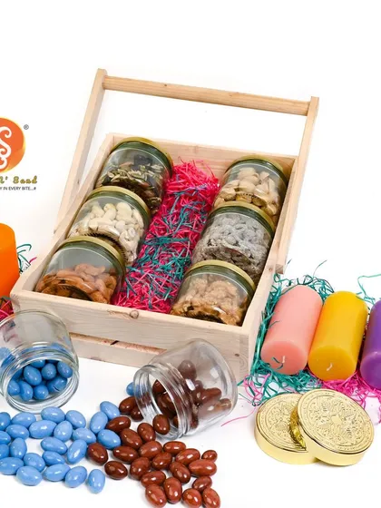 I can create diverse looks for your product line. This shot features a rustic wooden crate hamper, styled with colorful candles and treats to evoke a warm, celebratory feeling. It shows how I adapt the setup to match the product's specific theme, whether it's for Diwali or a corporate event.