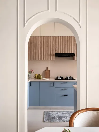 Another perspective through the elegant archway, emphasizing how architectural details can elevate the connection between different areas of a home, like the dining room and kitchen.