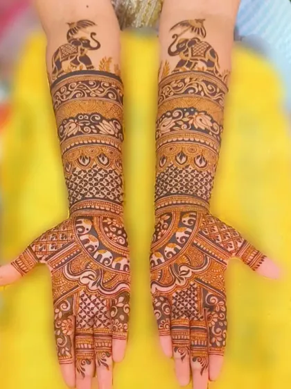 A classic design featuring elephants on the arms and intricate patterns on the hands, ideal for any festive occasion.