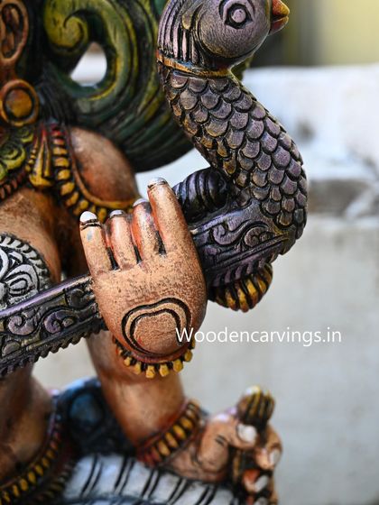 A close-up of the hand of the sold 36-inch Saraswathi, showcasing the delicate finger positions for playing the veena.