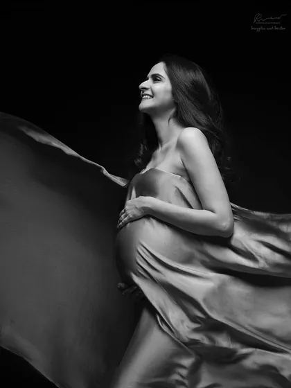 There is so much joy in simplicity. A single piece of fabric and the right light can create a timeless, high-contrast black and white portrait that feels both powerful and happy.