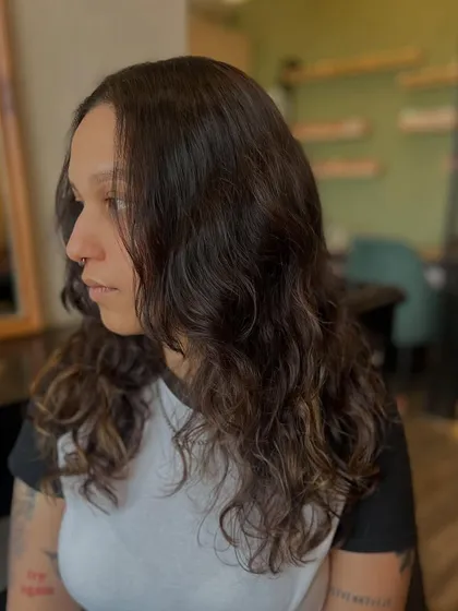 A side view of the "superpower" color transformation, showing the new cut and subtle highlights that frame the face.