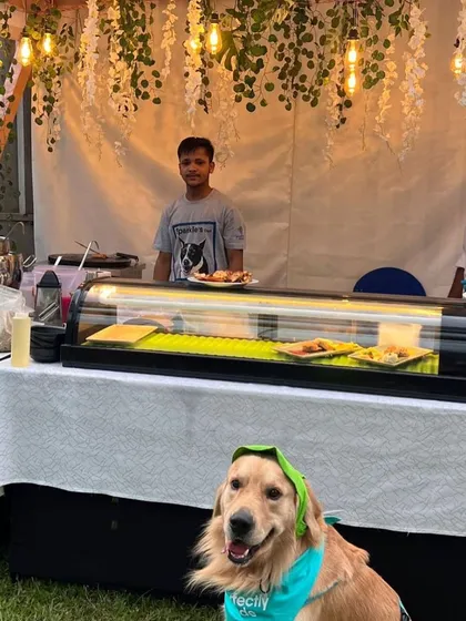 This stylish golden retriever was the star of the show at our food stall.