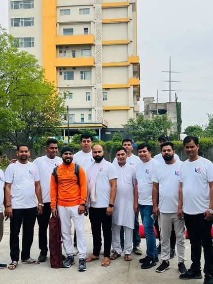 Posing with a group of participants after the yoga session at Kailash Hospital.