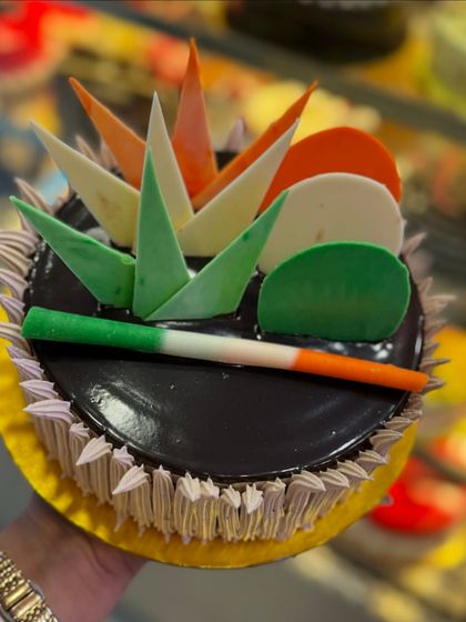 Another one of my Independence Day chocolate cakes, this one featuring tricolor chocolate shards. The design is modern and striking.