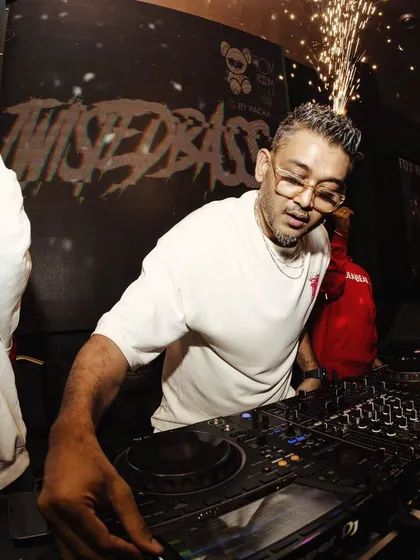 In the zone at Toy Room, Pune, with pyro going off in the background. I am completely focused on the mix and the crowd's energy.